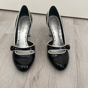 Black and white patent pumps